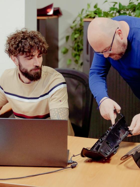 Two design engineers discussing at the workstation